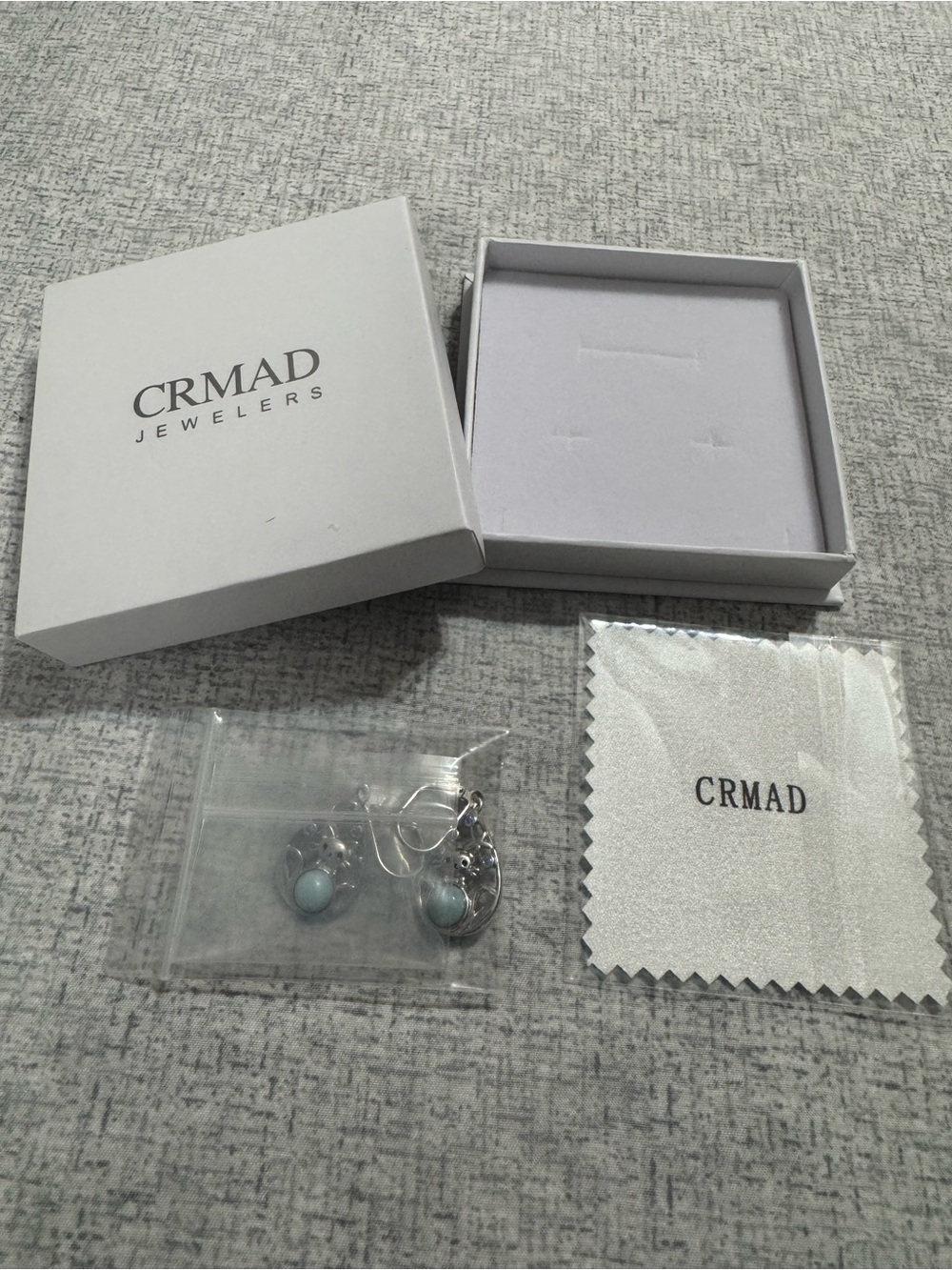 CRMAD Silver Drop Cat Earrings with Light Blue Stones